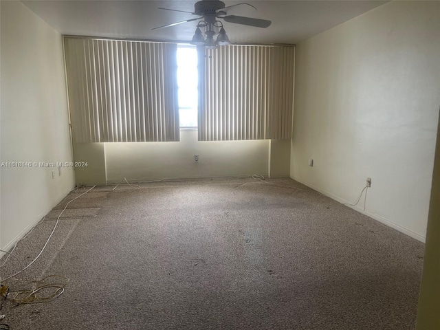 empty room with carpet floors and ceiling fan