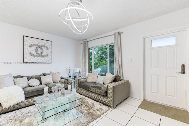 living room with light tile patterned flooring and an inviting chandelier