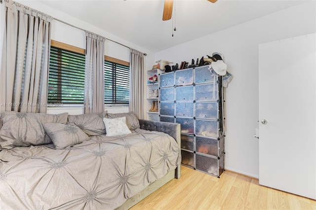 bedroom with hardwood / wood-style flooring and ceiling fan