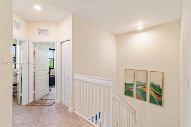 hallway with light carpet