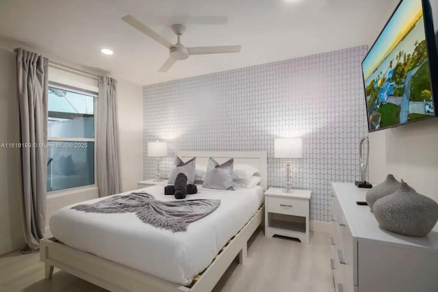 bedroom featuring ceiling fan and light wood-type flooring