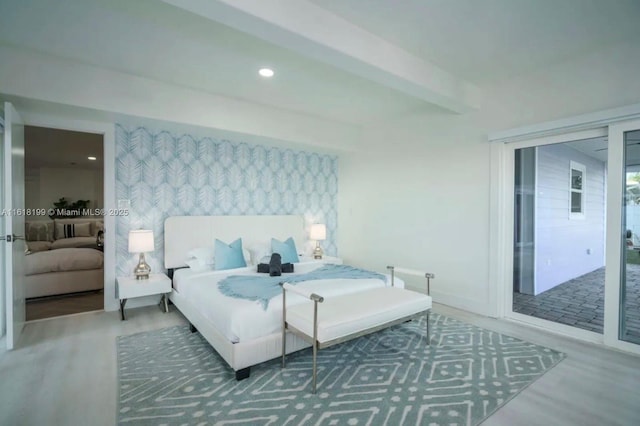 bedroom with wood-type flooring and beamed ceiling