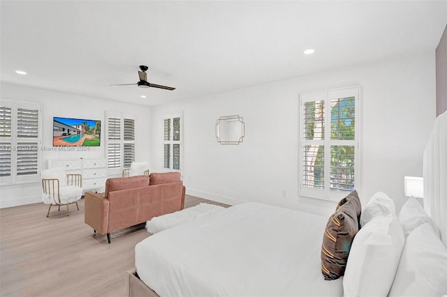 bedroom with light wood-type flooring and ceiling fan