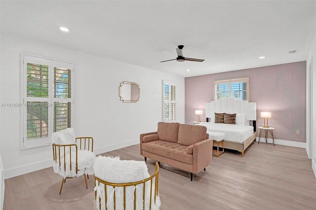 bedroom featuring light hardwood / wood-style flooring and ceiling fan