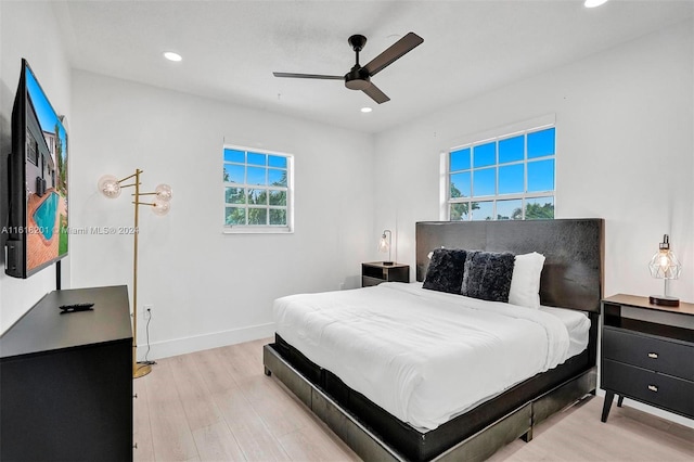 bedroom featuring ceiling fan and light wood-type flooring