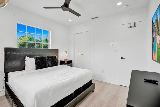 bedroom featuring light wood-type flooring and ceiling fan