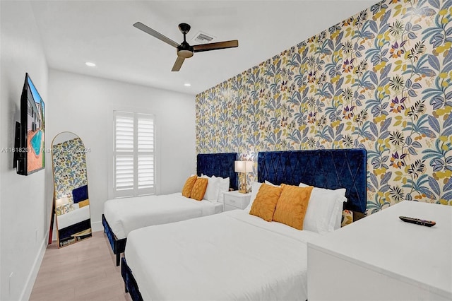 bedroom featuring ceiling fan and light wood-type flooring