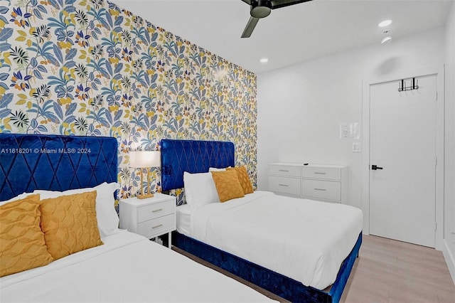 bedroom featuring ceiling fan and light hardwood / wood-style floors