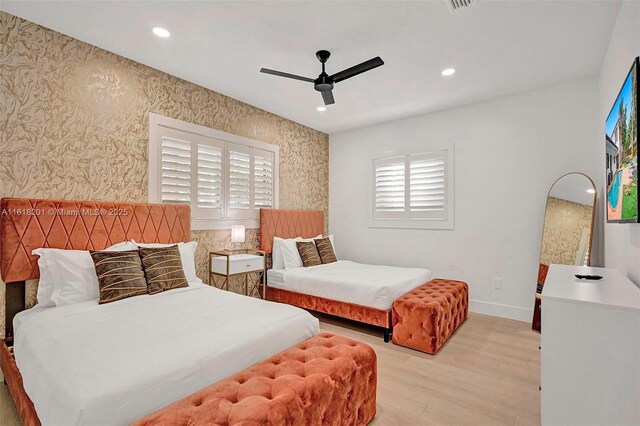 bedroom featuring ceiling fan and light hardwood / wood-style flooring