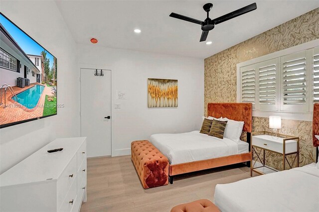 bedroom featuring ceiling fan and light wood-type flooring