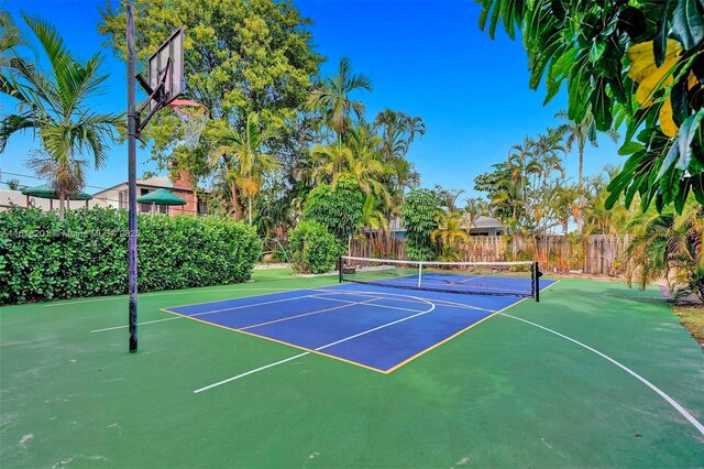 view of basketball court featuring tennis court