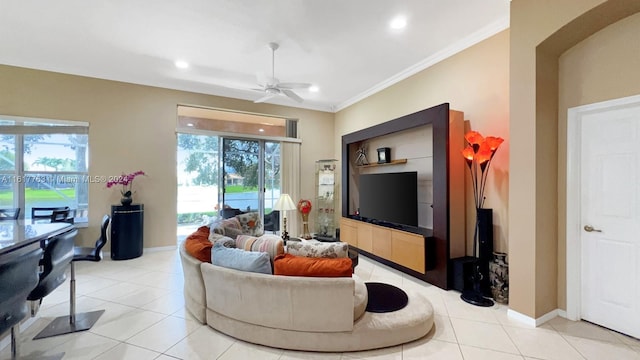 tiled living room with ceiling fan and crown molding