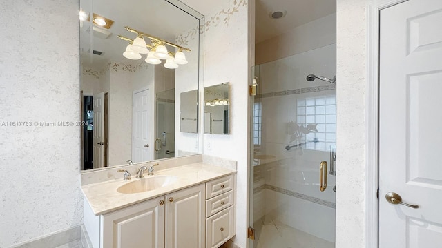 bathroom featuring vanity and a shower with door