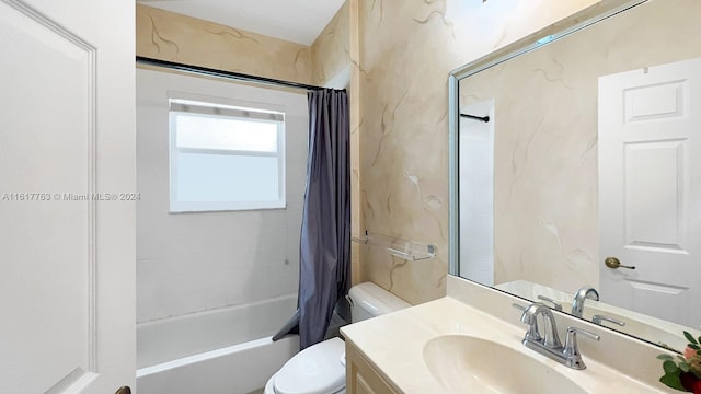 full bathroom featuring shower / bath combo, vanity, and toilet