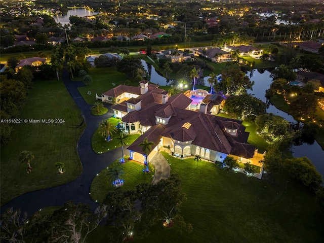 aerial view at night with a water view