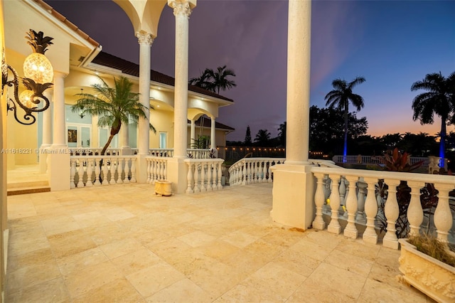 view of patio terrace at dusk