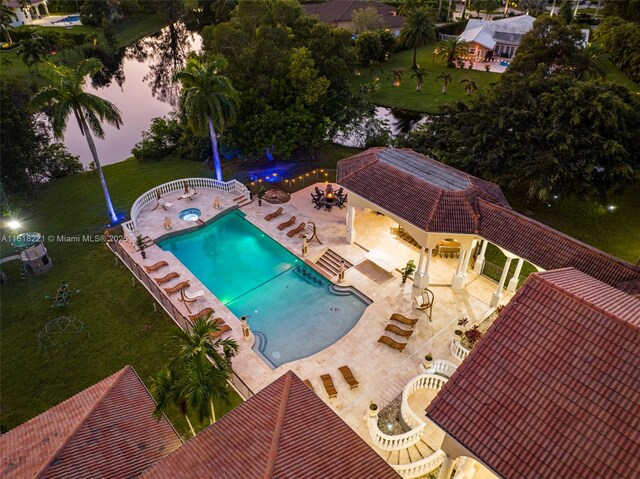 view of pool featuring a yard and a patio area