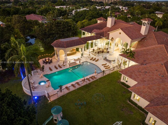 view of pool with a yard and a patio area