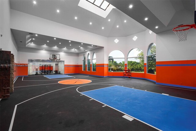 view of basketball court with a skylight