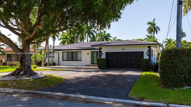 single story home with a garage