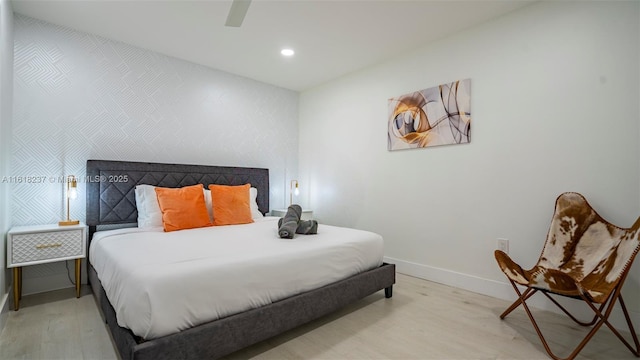 bedroom featuring ceiling fan and light hardwood / wood-style floors