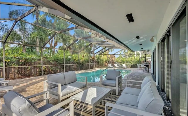 view of patio / terrace with an outdoor living space, grilling area, and glass enclosure