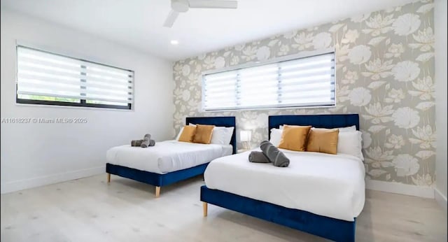 bedroom featuring hardwood / wood-style flooring and ceiling fan