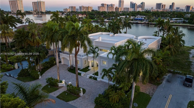 aerial view at dusk with a water view