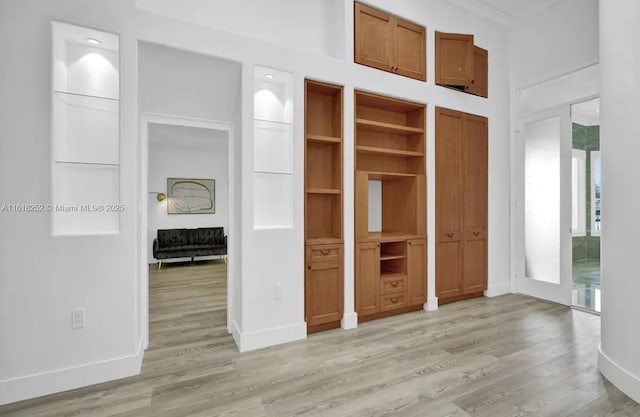 unfurnished bedroom with light wood-type flooring