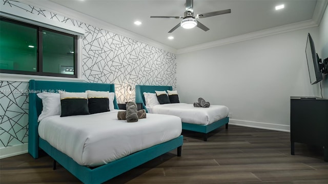 bedroom with hardwood / wood-style floors, ornamental molding, and ceiling fan