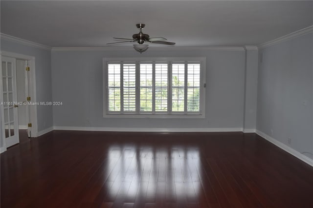 unfurnished room with ceiling fan, dark wood-type flooring, and ornamental molding