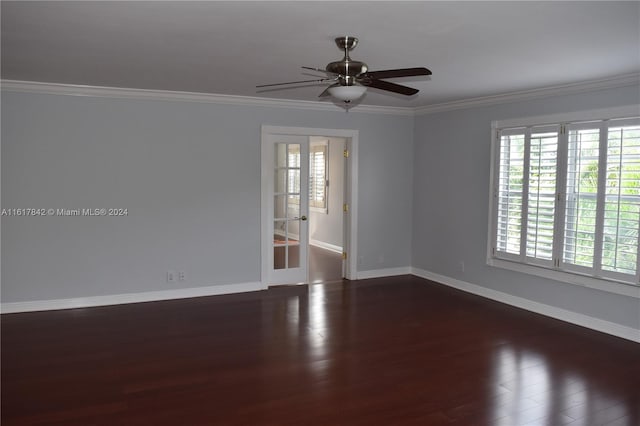 spare room with ceiling fan, dark hardwood / wood-style flooring, and ornamental molding