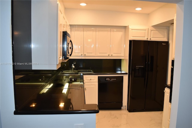 kitchen with sink, white cabinetry, and black appliances