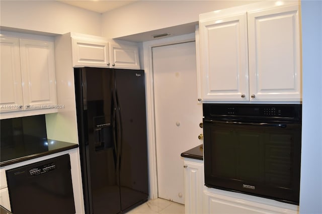 kitchen with white cabinetry and black appliances