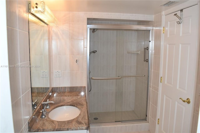 bathroom with vanity and walk in shower