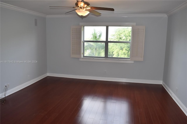 empty room with ceiling fan, dark hardwood / wood-style flooring, and ornamental molding