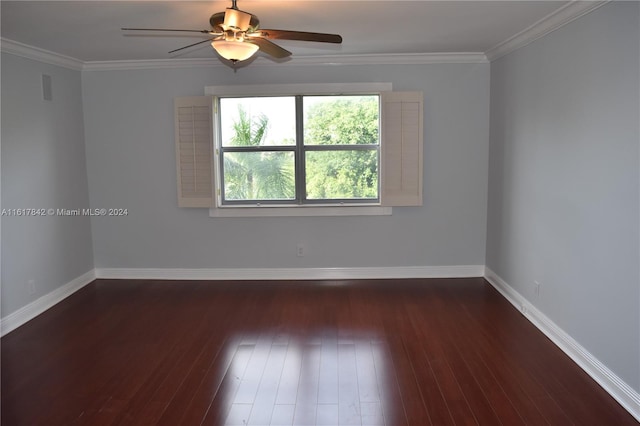 spare room featuring dark hardwood / wood-style floors, ceiling fan, and ornamental molding