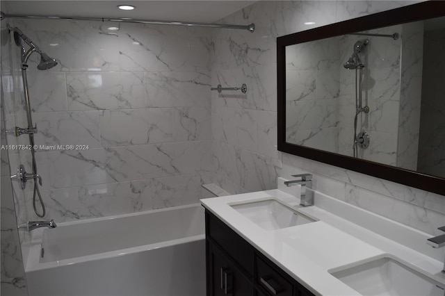 bathroom featuring vanity and tiled shower / bath combo