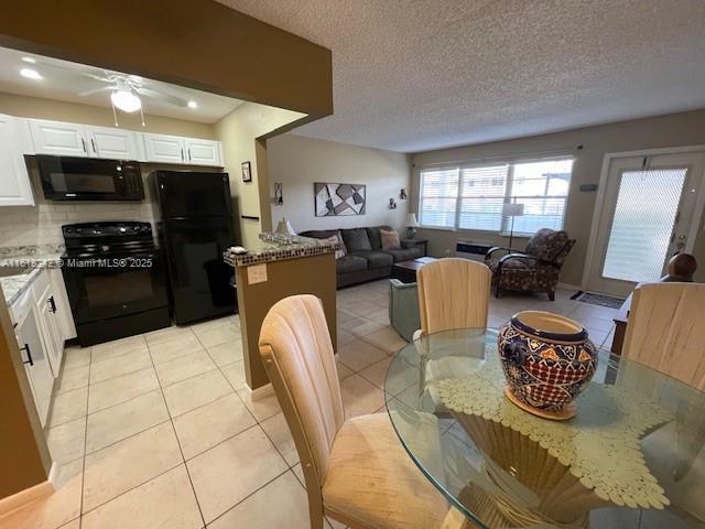 88 Tilford E Unit 88, Deerfield Beach, FL 33442 - dining space with light tile patterned floors, a ceiling fan, recessed lighting, and a textured ceiling