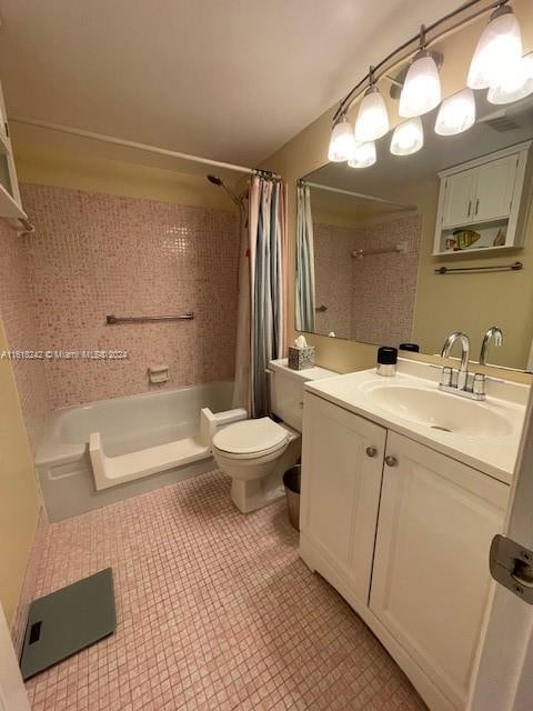 full bathroom with shower / bath combination with curtain, toilet, and vanity