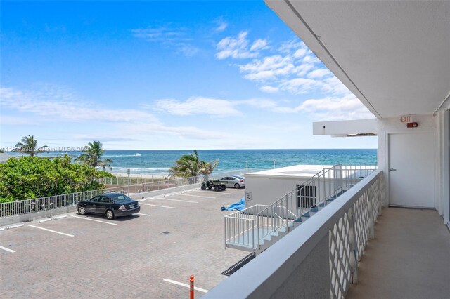 balcony featuring a water view