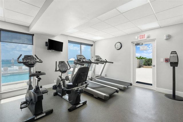 gym featuring a paneled ceiling