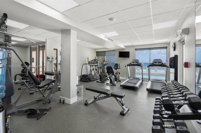 workout area with a drop ceiling