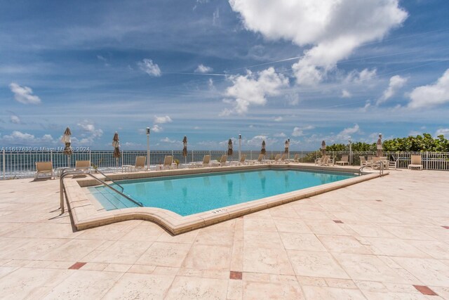 view of swimming pool with a patio area