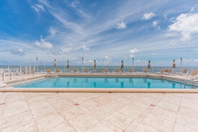 view of pool featuring a patio area