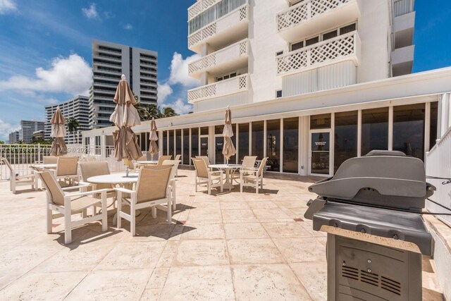 view of patio featuring a balcony