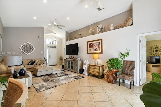 living room with ceiling fan, light tile patterned flooring, and high vaulted ceiling