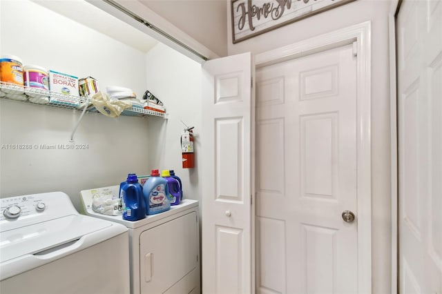 washroom featuring independent washer and dryer