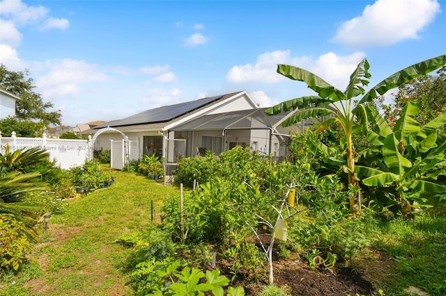 rear view of property with a yard