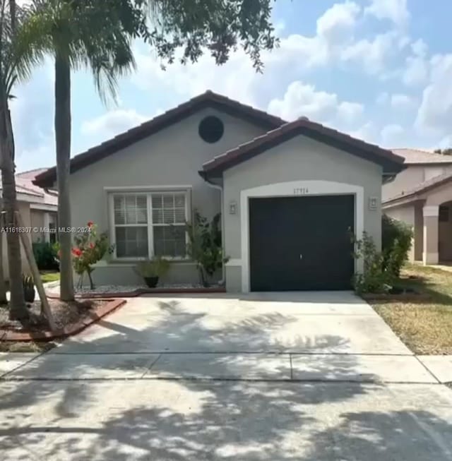 view of front of property with a garage